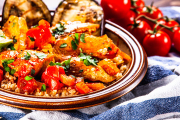 Roasted meat, groats and vegetables