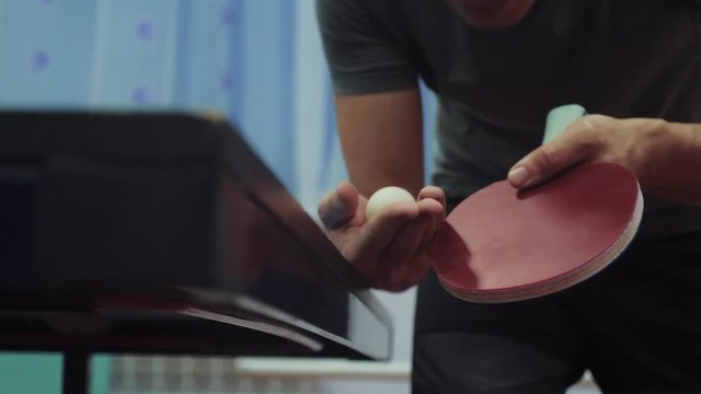 table tennis serve concept. slow motion video. blurred focus lifestyle on the grid. man playing training serve ball in table tennis the sport active