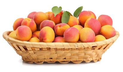 Apricots in a basket isolated on white