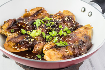 Homemade roasted chicken breast with apricot jam.