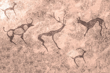 The image of ancient animals on the wall of the cave. history of antiquities, archaeology.