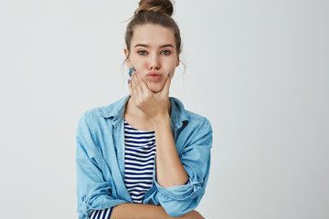 Girl cheer up near mirror stops sulking trying live optimistic, squeezing cheeks, grimacing silly, fooling around showing funny carefree faces, folding lips, posing trendy outfit white background