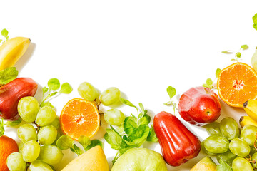 Beautiful colorful tropical fruits border isolated on white background. Detox. Text space