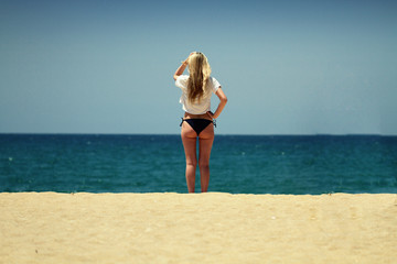 I wake up like this, Back of Sexy shape beautiful Blond Woman posing standing on the beach under clear blue sky in the middle of summer in Phuket, Thailand, Commercial advertisement for tourism during