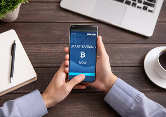 Bitcoin earning application on smartphone screen isolated