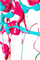 Fototapeta premium Pink And Blue Paint Spatters on White Background