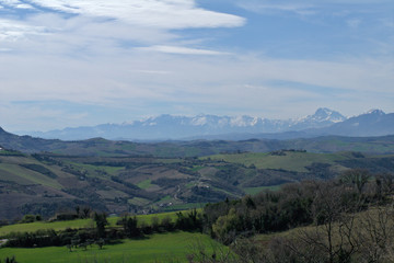 landscape in the mountains,italy,spring,countryside,rural,panoramic,nature,view,field,hills,cloud,sky