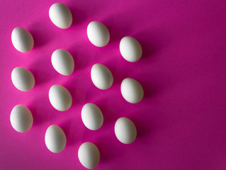 White Easter eggs in hexagon band on purple background