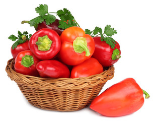 Sweet pepper in a basket isolated on a white background