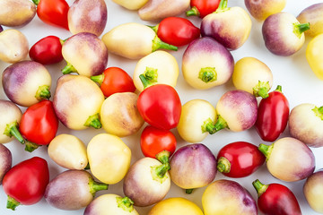Fresh colorful peppers on white background