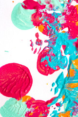 Pink Blue and Orange Paint Splatters on White Background