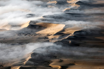 Fototapeta premium Fog over the sand sea of Sossusvlei, Namibia.