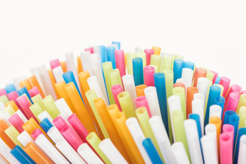Fototapeta premium selective focus of colorful and bright plastic tubes isolated on white with copy space