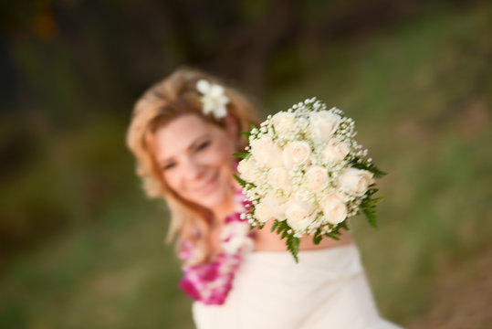 Smiling Bride holding bouquet