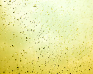 Water drops with the yellow background