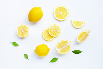 Lemon and slices with leaves isolated on white.