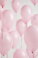 background with decorative pink balloons isolated on white © LIGHTFIELD STUDIOS