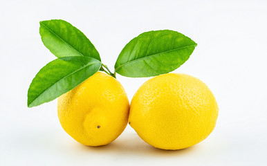 Fresh yellow lemon with leaves on white background