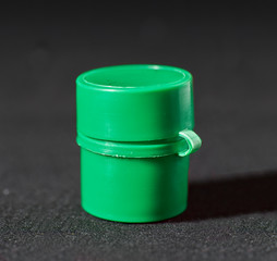 Plastic Film Canisters on dark background for 35mm film photography