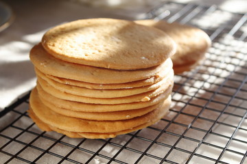 A stack of biscuits shortbread cookies pancake cakes for russian layered honey cake on cooling rack