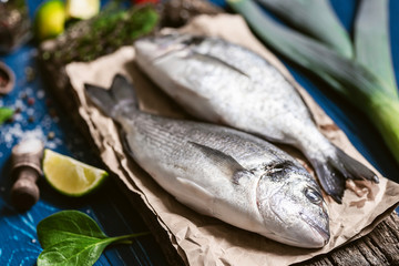 fresh raw dorado fish with spices. dinner for two with your loved one with your own hands.