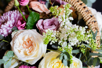 bouquet of lilac, rose, Narcissus, hyacinth, Ranunculus, Tulip, Bush rose, chrysanthemum, eucalyptus, animon, peony in a floral shop