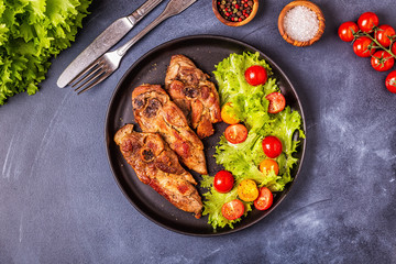 Roasted turkey steak with salad.