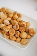 Sweets in a beautiful saucer on a white background