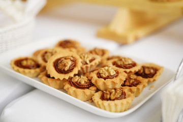 Sweets in a beautiful saucer on a white background