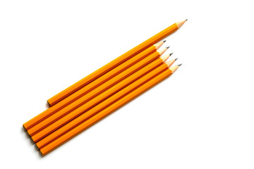 Obraz premium Several wooden graphite pencils isolated on a white background. Business leadership, teamwork and courage concept.