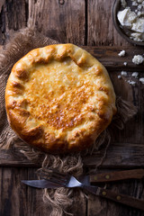 Set of Georgian and Adjarian Khachapuri Dishes on Black Rustic Background Top View. Homemade Ajarian Khachapuri, Megrelian and Grilled Khachapuries with Cheese Close Up Collection