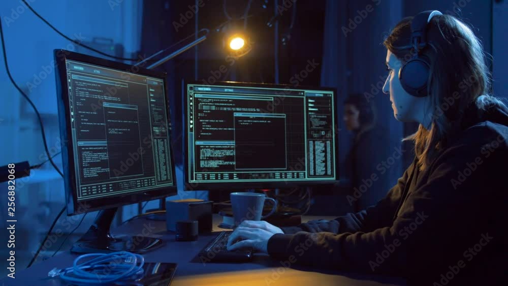 Poster cybercrime, hacking and technology concept - female hacker in dark room creating code or using compu