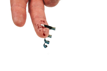 Chopped finger with metal shavings, blood flows