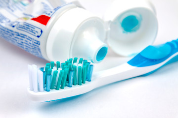 Tooth brush with tooth paste on white background
