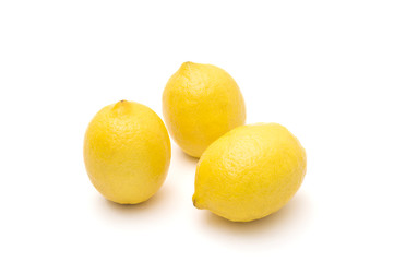 Ripe lemons on a white background, citrus fruits
