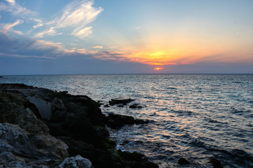 First spring sunset at the sea of Taranto, Puglia, Italy