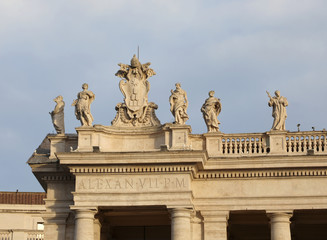 Fototapeta na wymiar statues above the Bernini colonnade in Saint Peters Square in th