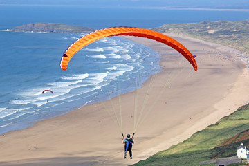 Paraglider flying at Rhossili