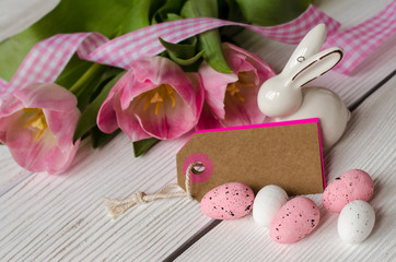 Easter egg and beautiful Tulips on a wooden background. Image