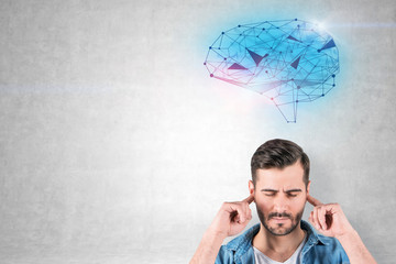 Man covering ears, brain hologram