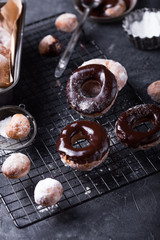 Homemade donuts with sugar and cinnamon on a wooden background. Rustic style.