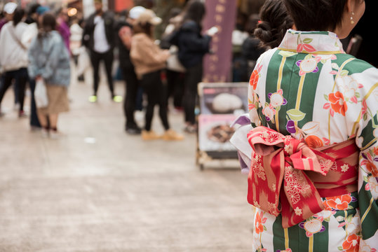 TOKYO,JAPAN - February 20, 2019 : People are wearing kimono while travel in Senso-ji Temple , famous temple in Tokyo,Japan.