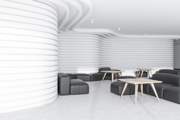White office lounge with black armchairs
