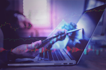 stock market chart doble exposure with business woman trading online on computer ,financial background concept