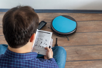 Reading the user guide for robot vacuum cleaner