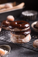Homemade donuts with sugar and cinnamon on a wooden background. Rustic style.