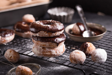 Homemade donuts with sugar and cinnamon on a wooden background. Rustic style.