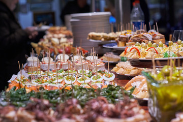 Pinchos and tapas typical of the Basque Country, Spain. Selection of different types of foods to choose from. San Sebastian