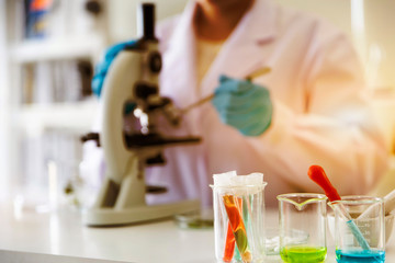 woman chemists working in the lab and test tubes for scientific research.
