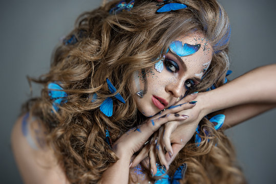 Girl with butterflies in her hair and gorgeous eye makeup